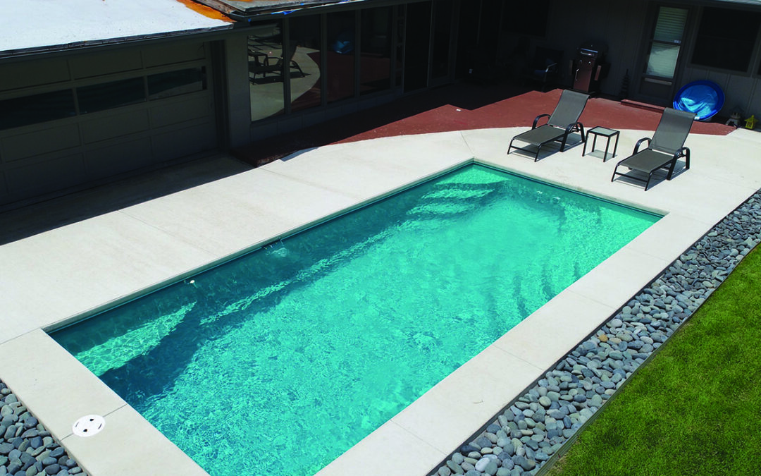 Beautiful blue swimming pool completed by Copano Pools and Spas